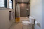 Upstairs bathroom with tub /shower combo & custom tile